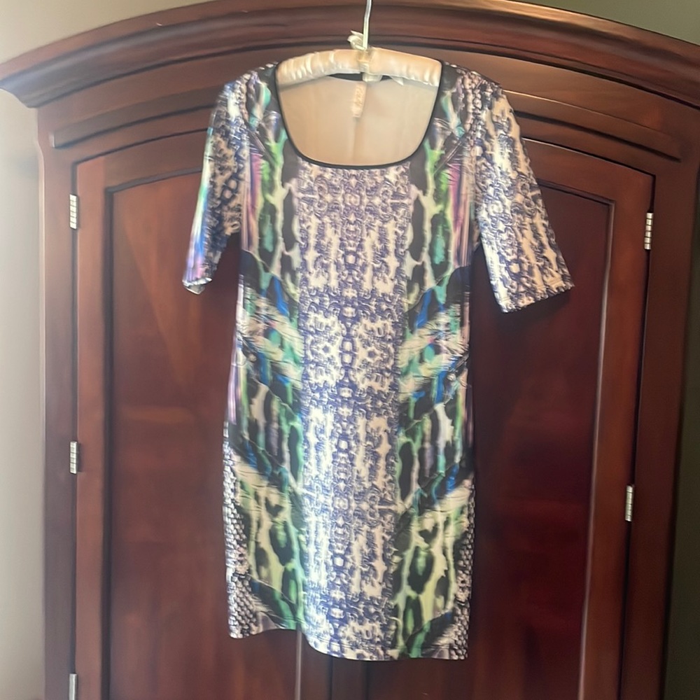 Sexy, figure hugging dress. Cosette website  quotes: “Timeless Femininity…”